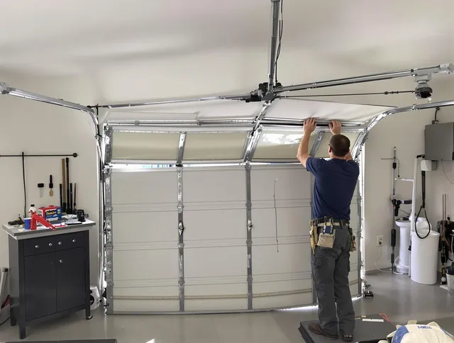 Poinciana Garage Door Repair specialist performing precise section replacement on Poinciana garage door
