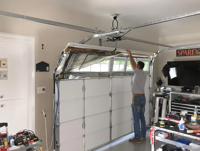 Garage door section replacement by Poinciana Garage Door Repair in Poinciana