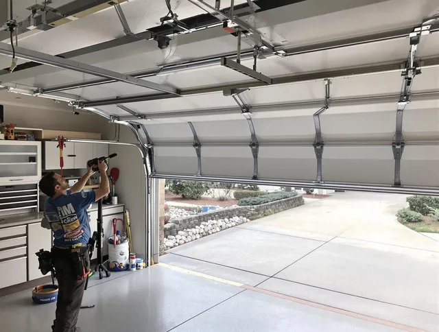 Garage door track repair service by Poinciana Garage Door Repair in Poinciana